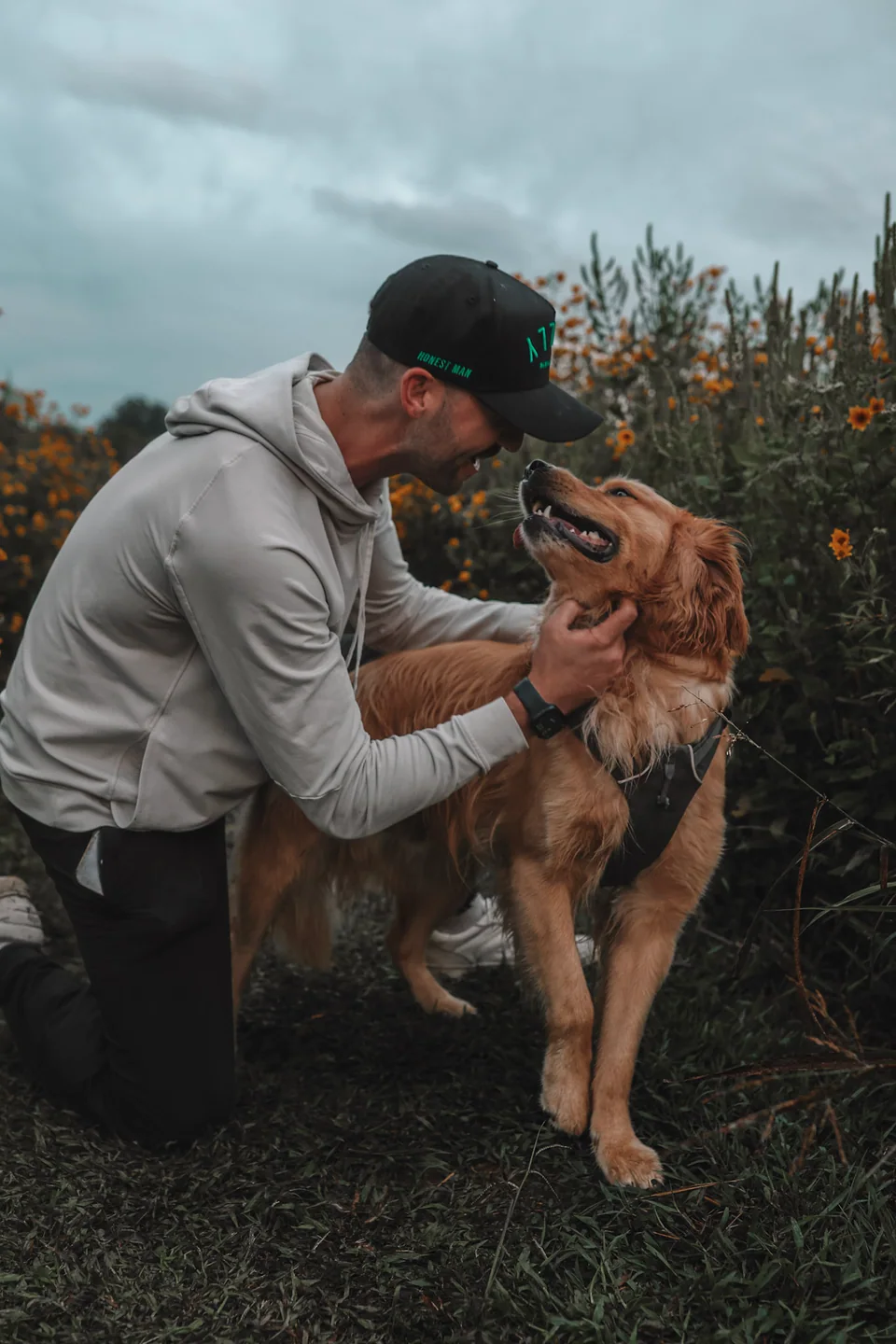 Brian Martori with his golden retriever, Claude